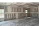 Spacious living room features freshly installed drywall, awaiting your personal design touches at 200 Green Pines Estates Dr, Kenly, NC 27542