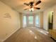 Large bedroom with carpeting, ceiling fan, and bay windows at 208B Mallard Creek Dr, Graham, NC 27253