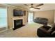 Cozy living room featuring a fireplace, ceiling fan, and a sofa at 208B Mallard Creek Dr, Graham, NC 27253