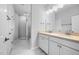 Bathroom with double vanity, granite countertop, and glass shower at 2328 Beeblossom Pl, Fuquay Varina, NC 27526