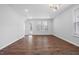 Open concept living area with recessed lighting, hardwood floors and lots of natural light at 2328 Beeblossom Pl, Fuquay Varina, NC 27526