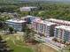 Aerial view of the condo building showcasing it's location near a golf course at 2402 Environ Way # Bldg 2000, Chapel Hill, NC 27517
