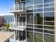 Exterior of the building showing multiple units with balconies and white railings overlooking the neighborhood at 2402 Environ Way # Bldg 2000, Chapel Hill, NC 27517
