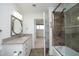 Bright bathroom with a vanity, a mirror, and glass shower door. It's conveniently located near the bedroom at 2402 Environ Way # Bldg 2000, Chapel Hill, NC 27517