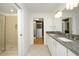 Bright bathroom featuring a double vanity with granite countertops and a glass shower at 2402 Environ Way # Bldg 2000, Chapel Hill, NC 27517