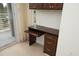 Bedroom featuring a built-in desk, hardwood floors, and sliding glass door to a balcony at 2402 Environ Way # Bldg 2000, Chapel Hill, NC 27517