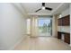 Bright bedroom featuring a ceiling fan, hardwood floors, and sliding glass door to a balcony at 2402 Environ Way # Bldg 2000, Chapel Hill, NC 27517