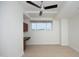Bright bedroom with a ceiling fan, built-in desk, and a large window with a view, creating a comfortable workspace at 2402 Environ Way # Bldg 2000, Chapel Hill, NC 27517