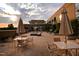 Outdoor courtyard featuring patio furniture, umbrellas, and well-maintained landscaping for residents at 2402 Environ Way # Bldg 2000, Chapel Hill, NC 27517