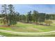 Scenic view of lush green golf course with mature trees and white fencing at 2402 Environ Way # Bldg 2000, Chapel Hill, NC 27517