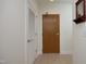 View of a hallway featuring closet and entry doors with hardware at 2402 Environ Way # Bldg 2000, Chapel Hill, NC 27517