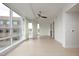 Open living space with hardwood floors, large windows, and modern ceiling fan at 2402 Environ Way # Bldg 2000, Chapel Hill, NC 27517