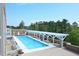Beautifully maintained community pool with ample seating and a pergola providing shade at 2402 Environ Way # Bldg 2000, Chapel Hill, NC 27517