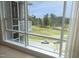 Close up of view from the unit featuring the golf course and tree-lined street at 2402 Environ Way # Bldg 2000, Chapel Hill, NC 27517