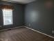 Comfortable carpeted bedroom featuring a sunny window and neutral walls at 2416 Fields Of Broadlands Dr, Raleigh, NC 27604