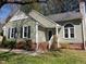 Charming home featuring a quaint entrance, well-maintained landscaping, and brick accents at 2416 Fields Of Broadlands Dr, Raleigh, NC 27604