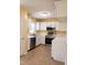 Well-lit kitchen featuring stainless steel appliances and ample counter space at 2416 Fields Of Broadlands Dr, Raleigh, NC 27604