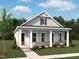 Charming single-story home featuring a covered porch with classic columns and a well-manicured front yard at 253 Marvel Dr # 134, Rolesville, NC 27571