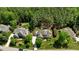 Stunning aerial view of the property showcasing the lush landscaping, mature trees, and well-maintained grounds at 255 Capellan St, Wake Forest, NC 27587