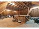 Unfinished attic space with exposed wood beams and plywood flooring at 255 Capellan St, Wake Forest, NC 27587