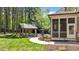 Enjoy a private backyard oasis with a pergola, lush landscaping, and access to the screened porch at 255 Capellan St, Wake Forest, NC 27587