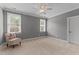 Bedroom with carpet, light walls, ceiling fan and windows providing lots of natural light at 255 Capellan St, Wake Forest, NC 27587