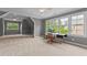 Bright bonus room with large windows, neutral walls, and plush carpeting at 255 Capellan St, Wake Forest, NC 27587