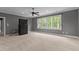 Bonus room featuring large windows, carpet, crown molding, and a ceiling fan at 255 Capellan St, Wake Forest, NC 27587