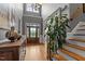 Grand foyer featuring soaring ceilings, chandelier, staircase, and hardwood floors at 255 Capellan St, Wake Forest, NC 27587