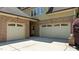 Spacious three-car garage with ample parking and brick accents at 255 Capellan St, Wake Forest, NC 27587