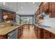 A kitchen with wood cabinets, granite countertops, stainless steel appliances, and an eat-in breakfast nook at 255 Capellan St, Wake Forest, NC 27587