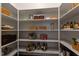 Walk-in pantry with ample shelving and patterned shelf liners at 255 Capellan St, Wake Forest, NC 27587