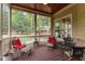 Inviting screened porch with comfortable seating and wooded views, perfect for relaxing outdoors at 255 Capellan St, Wake Forest, NC 27587