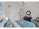 This bedroom has an fun style with a round mirror and unique decorations at 257 Reese Dr, Willow Springs, NC 27592