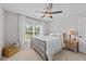 This bedroom has a window with a nice view, fan and a basket for storage at 257 Reese Dr, Willow Springs, NC 27592