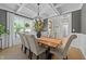 Elegant dining room featuring coffered ceilings, a modern chandelier, and neutral decor at 257 Reese Dr, Willow Springs, NC 27592