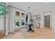 Bright dining area featuring a round table, elegant light fixture, and access to an outdoor seating area at 257 Reese Dr, Willow Springs, NC 27592
