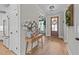 Welcoming foyer with hardwood floors, decorative table, and views into the adjacent living spaces at 257 Reese Dr, Willow Springs, NC 27592