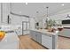 Spacious kitchen with a large island, stainless steel appliances, and open to the living area at 257 Reese Dr, Willow Springs, NC 27592