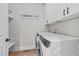Clean laundry room with modern appliances and ample shelving for storage at 257 Reese Dr, Willow Springs, NC 27592
