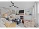 Cozy living room with a fireplace, built-in shelves, and a staircase, perfect for Gathering gatherings at 257 Reese Dr, Willow Springs, NC 27592
