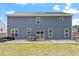 Home's backyard features a patio, seating, and a lawn at 30 Dowdy Ct, Youngsville, NC 27596