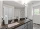 Bathroom boasts granite countertops, double sinks, and a view of the walk-in shower at 30 Dowdy Ct, Youngsville, NC 27596