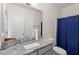 Clean bathroom featuring modern fixtures, a granite countertop, and a shower with curtain at 30 Dowdy Ct, Youngsville, NC 27596