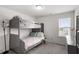 Charming bedroom featuring bunk beds, carpet floors, neutral paint, and lots of light at 30 Dowdy Ct, Youngsville, NC 27596