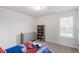 This cozy bedroom features carpet floors, a closet, and a window with lots of light at 30 Dowdy Ct, Youngsville, NC 27596
