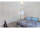 Comfortable bedroom with a full sized bed, carpet, and a view of the outside at 30 Dowdy Ct, Youngsville, NC 27596