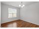 Empty dining room with wood floors, neutral paint and a window that lets in natural light at 30 Dowdy Ct, Youngsville, NC 27596