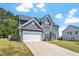 Beautiful two-story home with an attached two car garage, landscaped yard, and fenced in yard at 30 Dowdy Ct, Youngsville, NC 27596