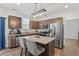 Stylish kitchen boasts granite counters, stainless appliances, and pendant lighting at 30 Dowdy Ct, Youngsville, NC 27596